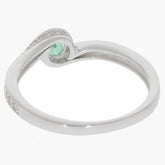 Round green emerald sterling silver ring with accent, showcasing a unique design and elegant craftsmanship.